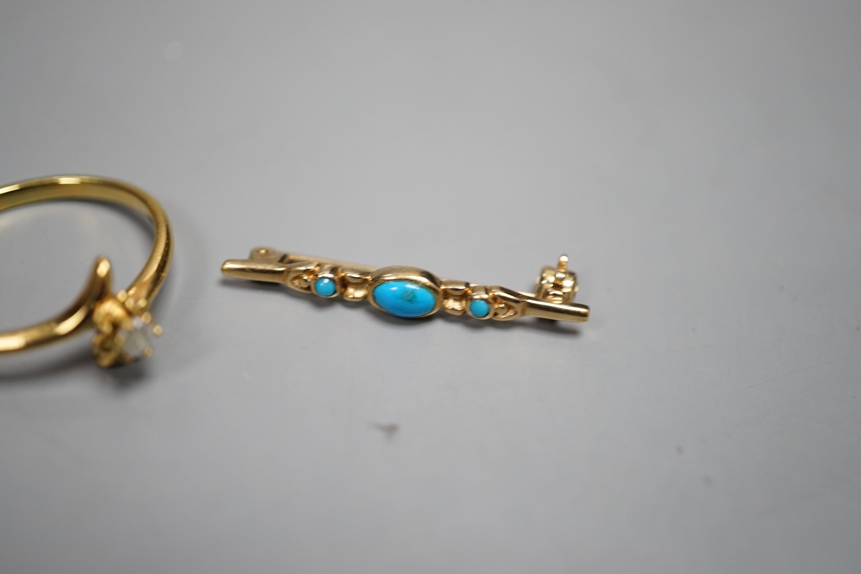 A small 375 yellow metal and three stone turquoise set bar brooch, 29mm, gross 1.1 grams and a ring.